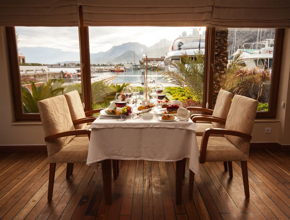 Private dining table overlooking a marina
